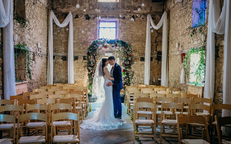 Ashbarton Estate - Bride and groom in the old chapel at Ash Barton wedding venue Devon 
