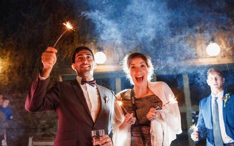 Ashbarton Estate - Wedding guests with sparklers at Ash Barton wedding venue Devon 