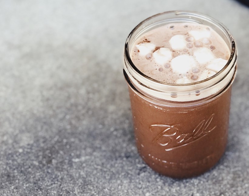 Glass of hot chocolate with marshmallows for winter wedding