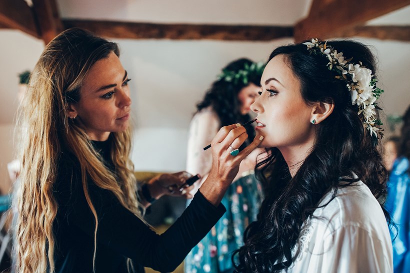 Bride has make up applied at Ash Barton wedding venue