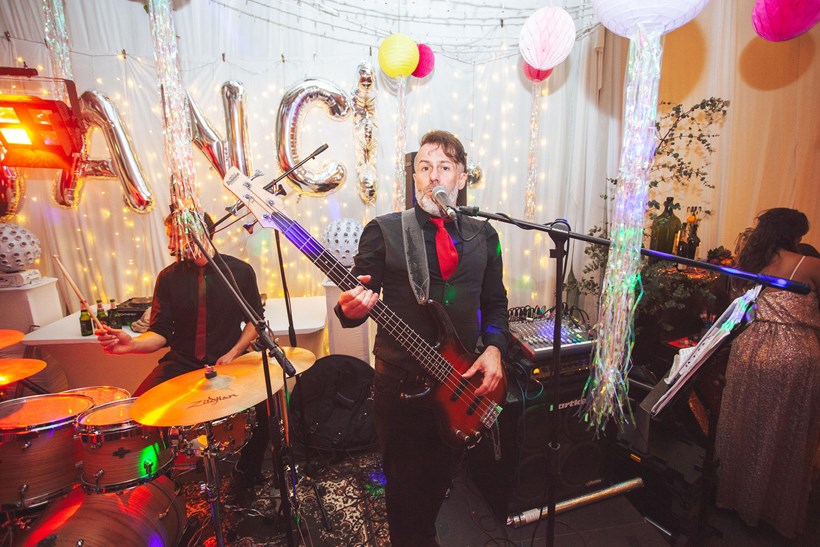 Man with guitar plays at wedding Ash Barton