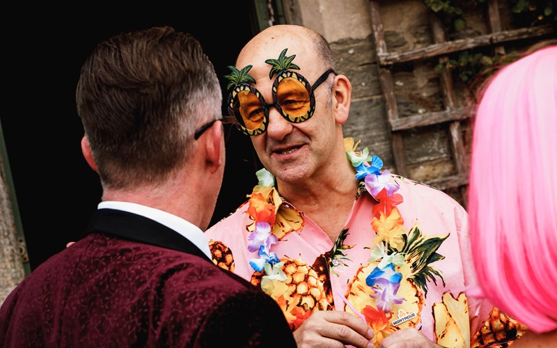 Ashbarton Estate - Man in pineapple glasses and Hawaiian shirt at Ash Barton wedding venue Devon