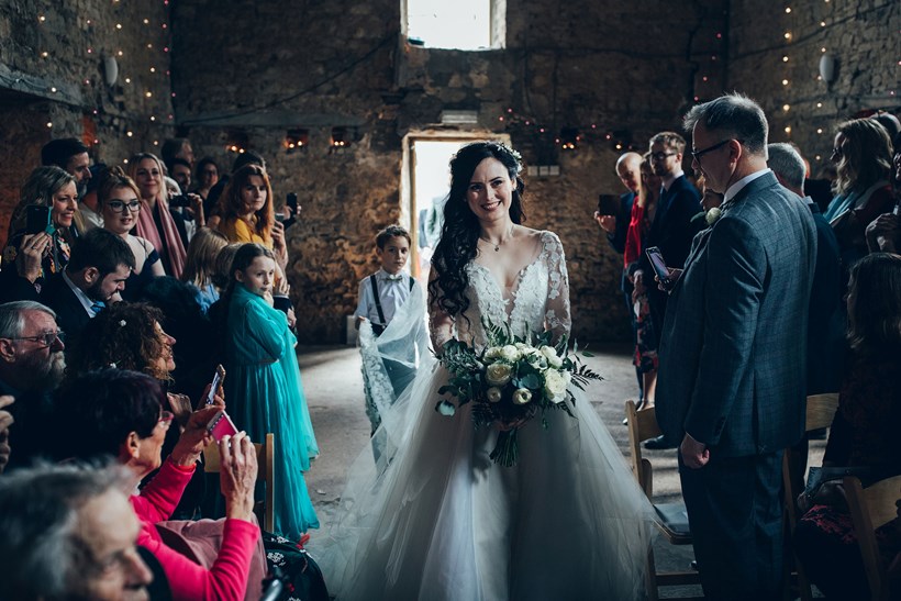 Bride walks down the aisle in old chapel Ash Barton Devon