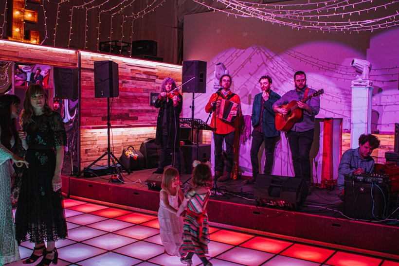 Band perform at Ash Barton Devon two small children dance