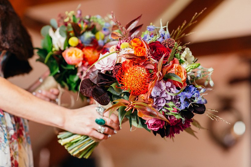 Brightly coloured floral wedding bouquets at Ash Barton Devon Wedding Venue
