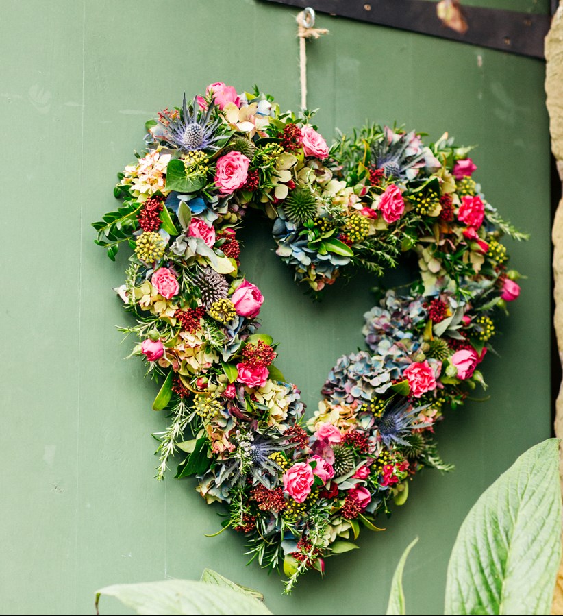 Heart shaped floral display Ash Barton Wedding