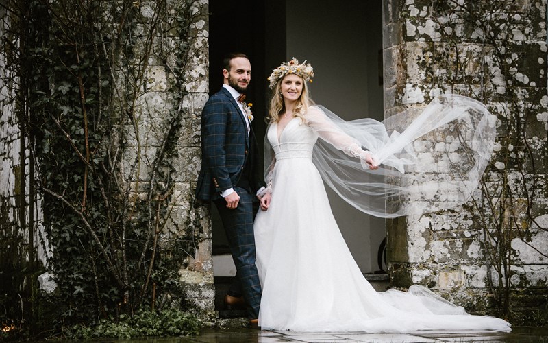 Ashbarton Estate - Bride and groom in porch at Ash Barton wedding venue Devon 