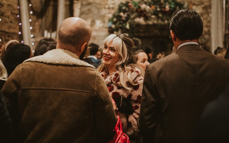 Ashbarton Estate - Wedding guests mingling in old chapel at Ash Barton wedding venue Devon