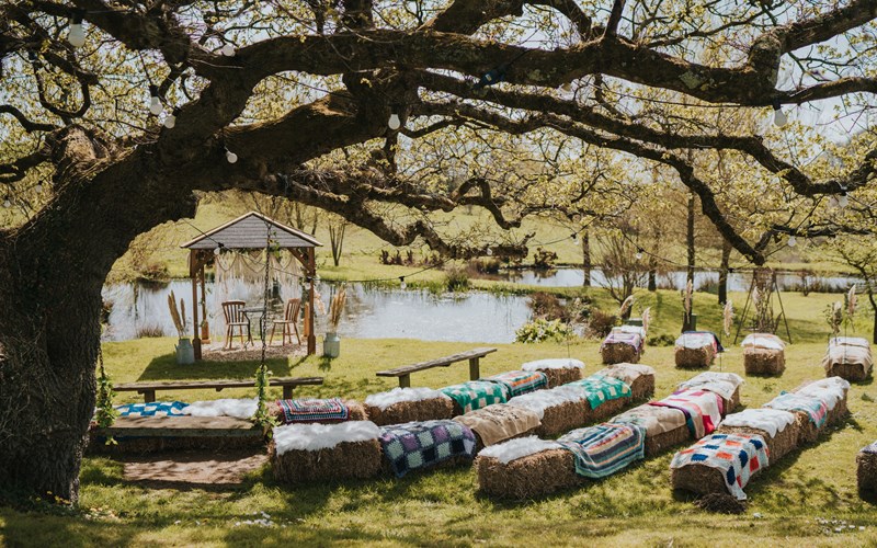 Ashbarton Estate - Hay bales and pagoda under the old oak tree at Ash Barton wedding venue Devon 