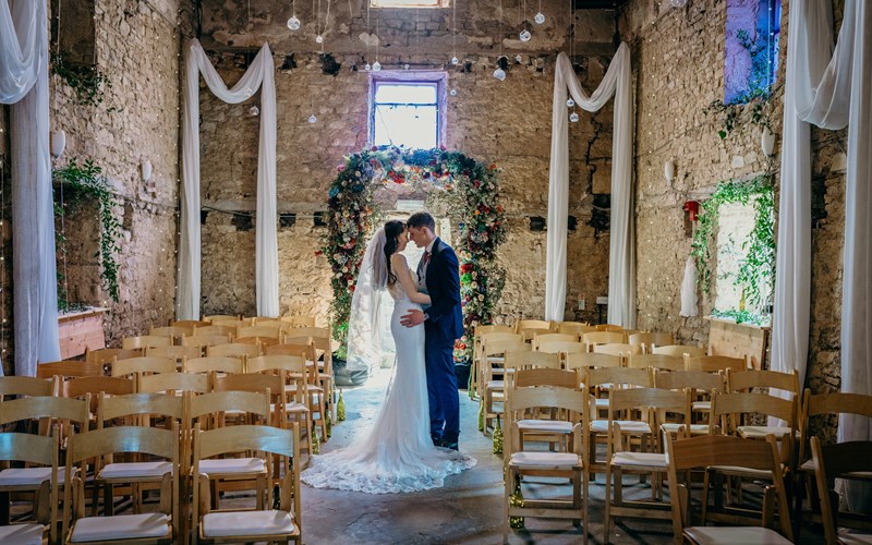 Ashbarton Estate - Bride and groom in the old chapel at Ash Barton wedding venue Devon
