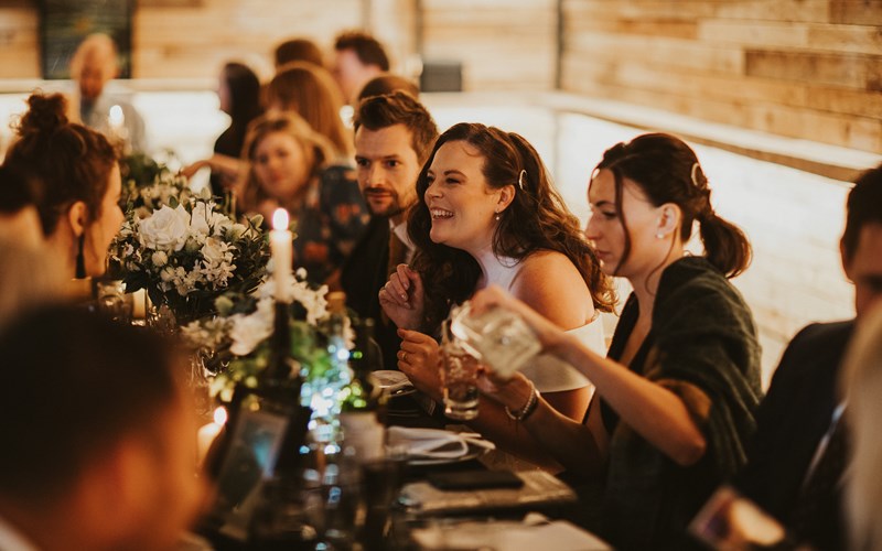 Ashbarton Estate - Wedding guests enjoying wedding breakfast at Ash Barton wedding venue Devon