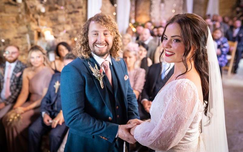 Ashbarton Estate - Bride and groom in the old chapel at Ash Barton wedding venue Devon 