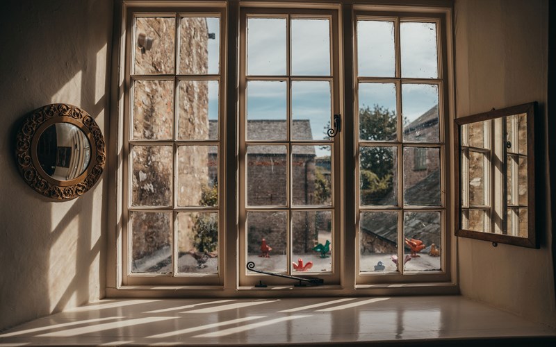 Ashbarton Estate - Window looking out on to courtyard at Ash Barton wedding venue Devon