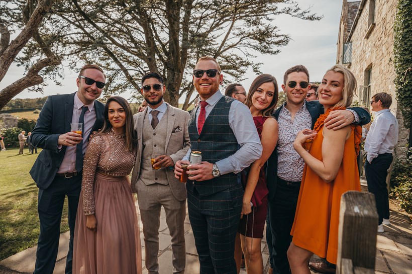 Wedding guests in sunglasses at Ash Barton Devon wedding venue