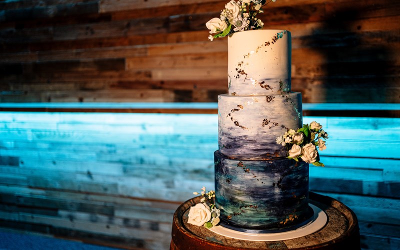 Ashbarton Estate - Blue and white wedding cake at Ash Barton wedding venue Devon