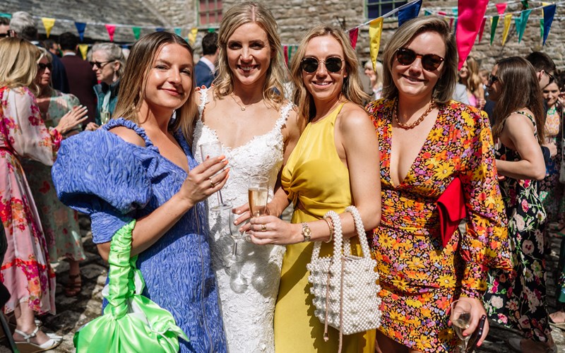 Ashbarton Estate - Wedding guests mingling in courtyard at Ash Barton wedding venue Devon
