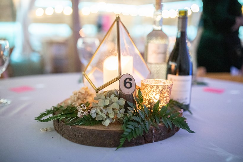 Table display with a candle at Ash Barton wedding venue Devon